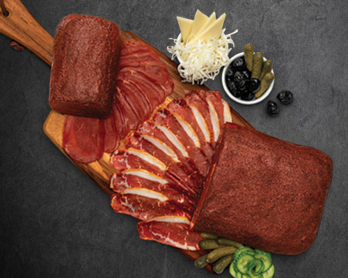 Ohanyan's Bastirma on a cutting board with mezze Photography