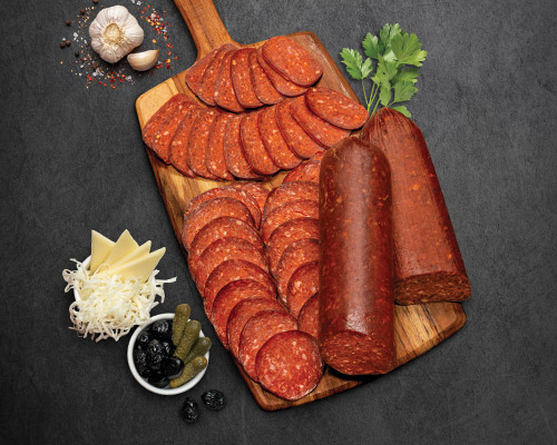 Ohanyan's Soujouk on a cutting board with mezze Photography